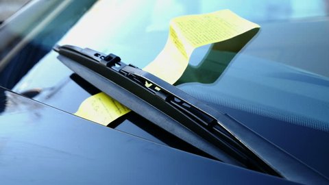 windshield and wipers with parking ticket