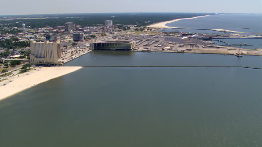Flight along waterfront with wide view of Gulfport, Mississippi. Shot in 2007.