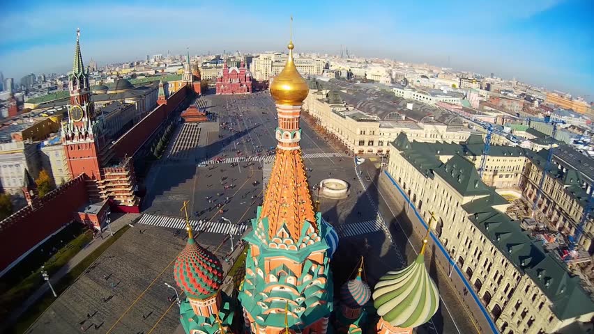 Saint Basil's Cathedral church in the Red Square museum UNESCO Moscow Russia  Pokrovsky. Central red square. Tourists walk. Decor of facades  Colored domes old architecture. Summer blue. Aerial above