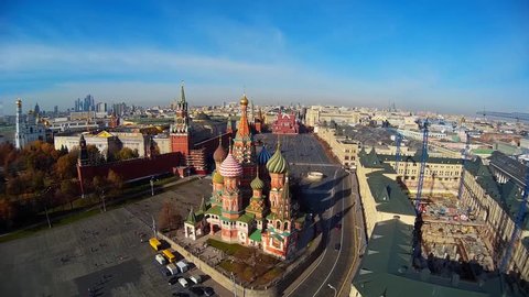 Saint Basil's Cathedral church Red Square museum UNESCO Moscow Russia  Pokrovsky. Central red square Tourists walk. Decor of facades Colored domes old architecture. Summer blue sky. Aerial Span to