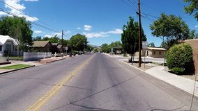 COTTONWOOD, AZ/USA: April 20, 2017- Car view driving shot in Cottonwood Arizona. Clip reveals a view passing by homes and other living quarters along a street in small town.