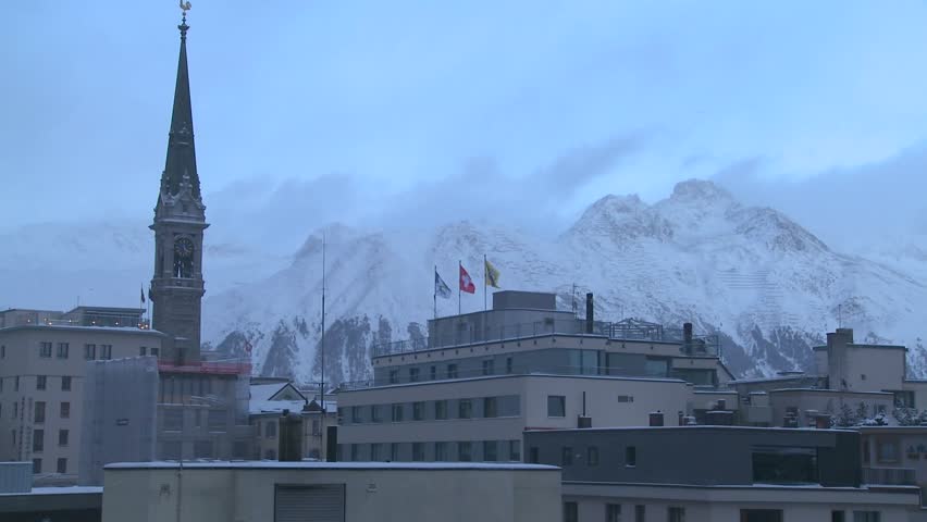ST. MORITZ, SWITZERLAND-CIRCA 2011-A church with a large spire in the winter.