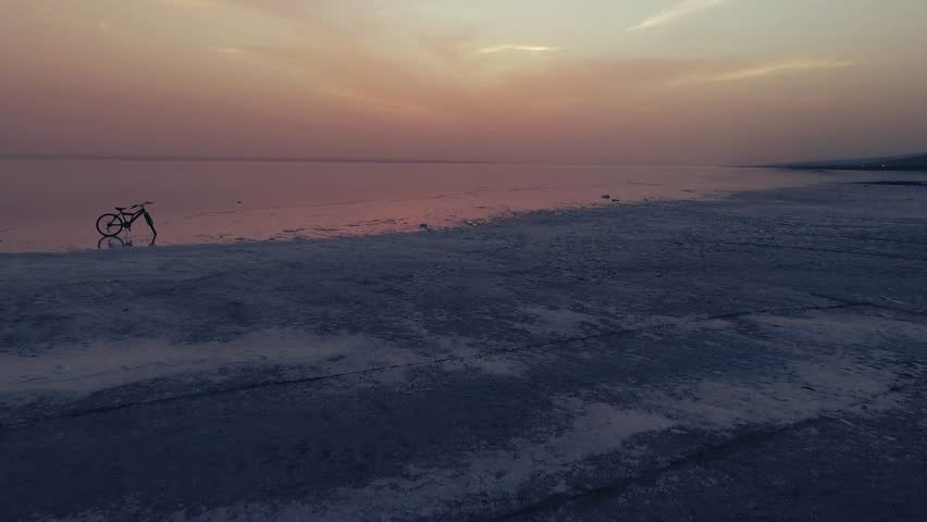 Sunset at salt lake Turkey. sunrise reflection on salt flat covered with water and clouds 