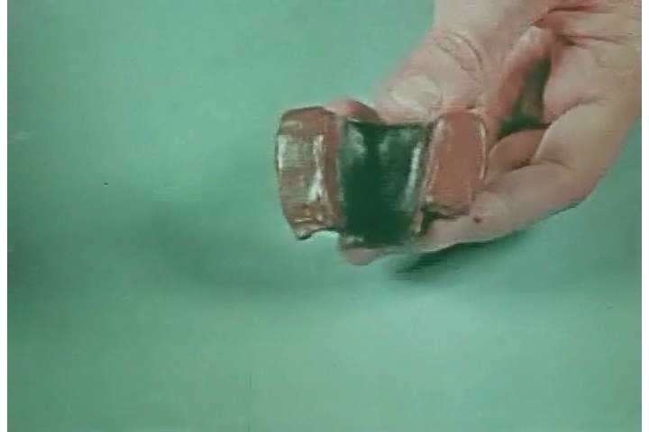 1940s: A dentist fits together pieces of dentures, in 1944.