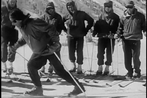 1940s: Paratroopers train in the snow to ski in the Arctic, during World War 2, in 1944.