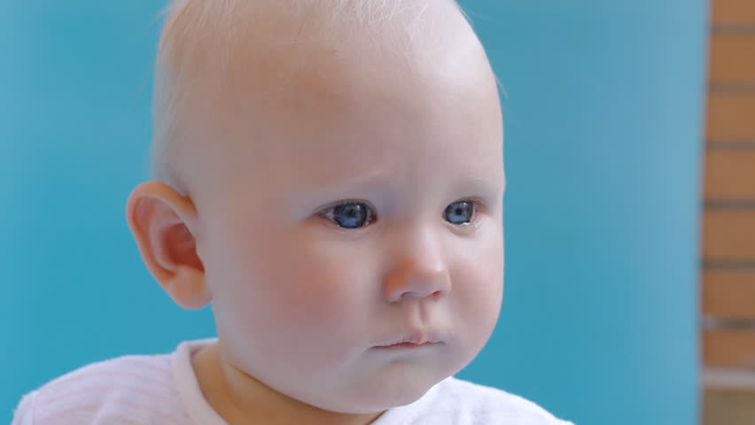 Closeup shot of baby with tears in eyes