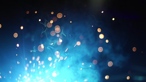 Welding sparklers particles in black background. spark super slow motion 
Gold particles title background sparkles glitter particles