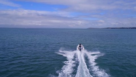 A Powerboat Travelling Through the Water at High Speed 