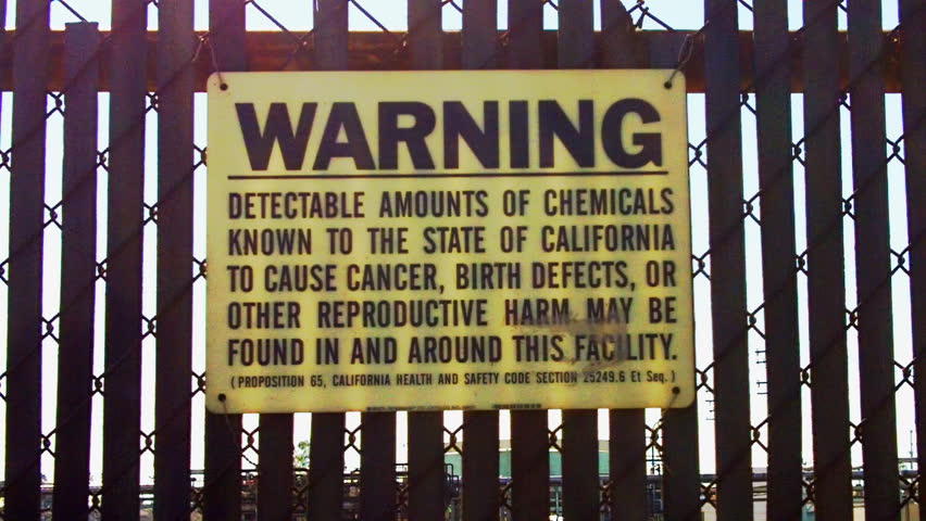 LOS ANGELES, CA/USA - August 2, 2012: A warning sign at an oil refinery warns of