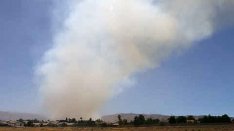 Column of smoke behind a residential area near Palmdale, California