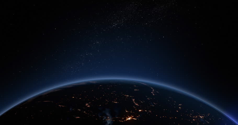 Earths atmosphere as viewed from space with the suns light starting to rise as the earth rotates. Royalty-Free Stock Footage #26872837