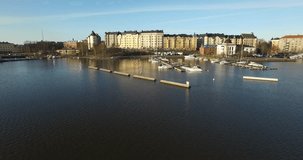 Aerial view drone footage of Helsinki Baltic Sea lagoon area, city skyline, Helsingfors view with vintage architecture and boats in spring morning, the capital of Finland Suomi, northern Europe
