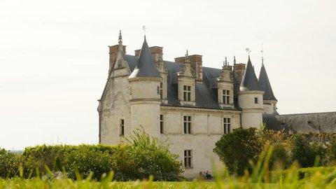 AMBOISE, FRANCE - CIRCA 2017: Unique footage of Royal Chateau de Amboise - Loire Valley Castle of Amboise Indre-et-Loire, Loire Valley with senior couple sitting on the bench at the castle base