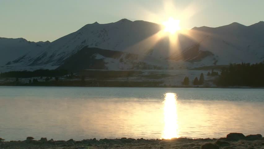 Lake Tekapo, New Zealand. Circa July 2011. Sunrise with shimmering reflections