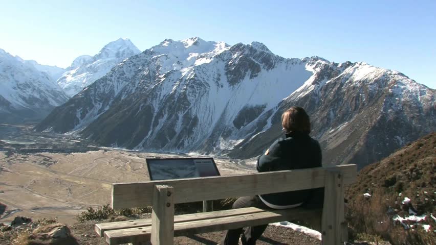 Mt. Cook, New Zealand. Circa July 2011. Tramper looking out over Mt Cook and valley from Red Tarn walkway one of many short walks  in the area