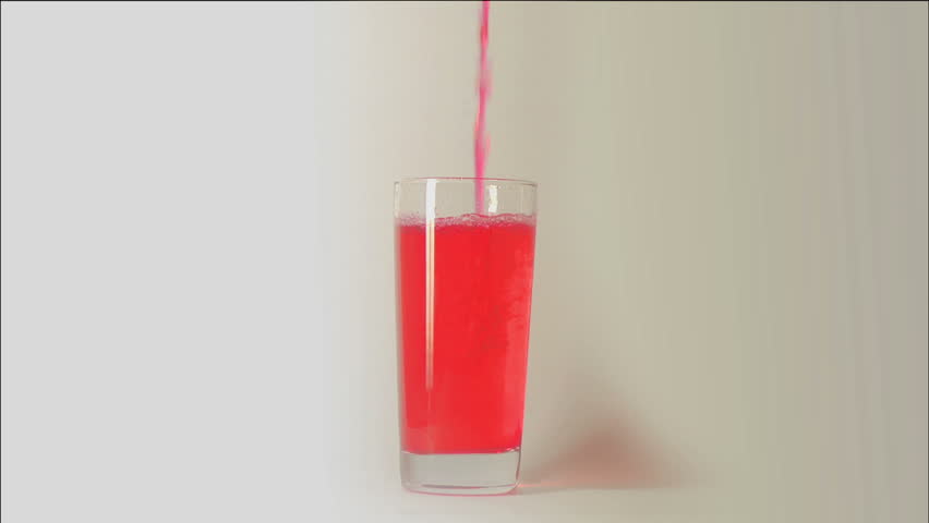 Poring red liquid