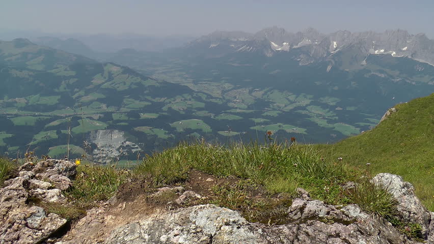Standing on top of a Mountain stock footage. Looking out toward distant