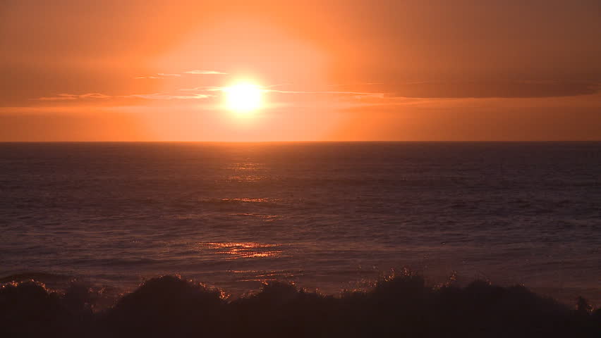 Brilliant red sunrise over the ocean