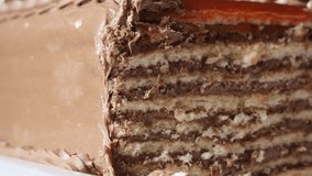 Tilting on layers of tasty torte with biscuits 4K 2160p 30fps UltraHD footage - Creamy  chocolate cake on the plate slow tilt 3840X2160 UHD video