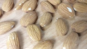 Healthy and delicious almonds are rotating on wooden background close up.
Footage will work great for any videos dealing with healthy food, healthy lifestyle, dietetics or cooking and baking. 