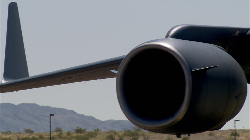 Close-up pan over engines and nose of a Boeing C-17