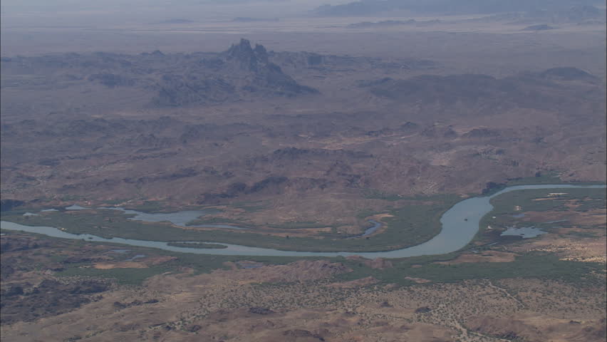 Wide view of Colorado River flowing through the desert near Arizona/California border