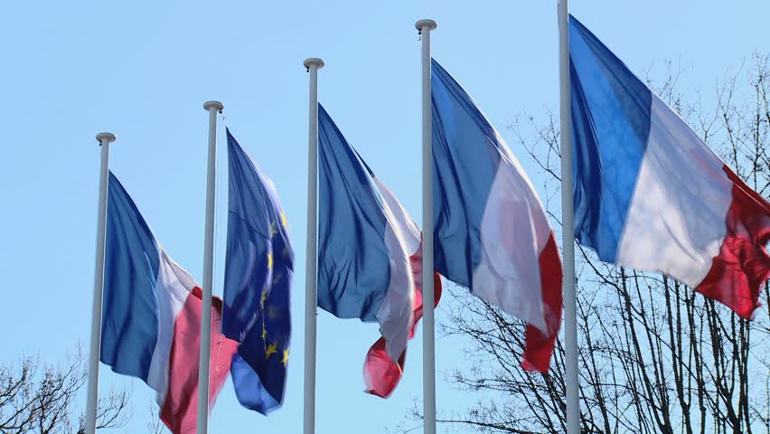 PARIS - February 2016 : Three french flags and one european union flag in the wind. Royalty-Free Stock Footage #26902738