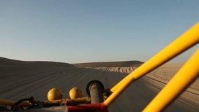 video footage of driving with a buggy off-road in the dunes of Ica, Peru