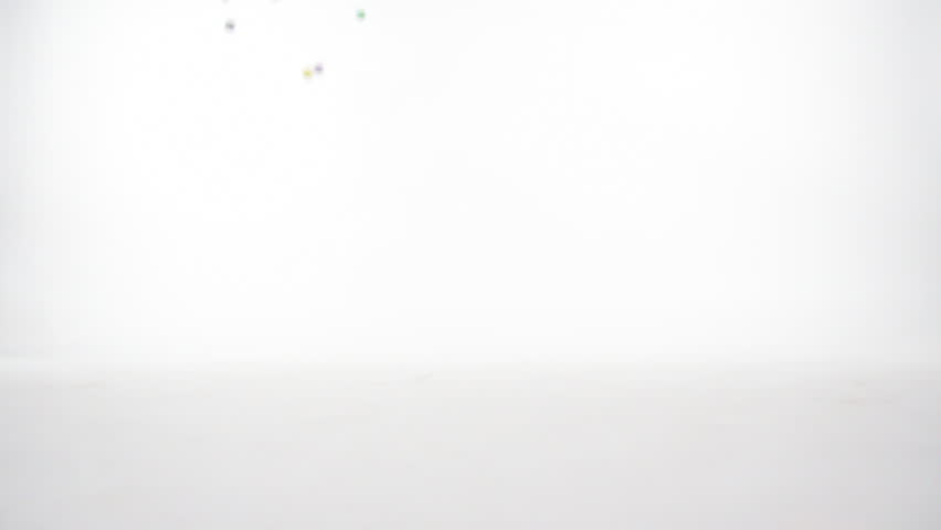 Slow motion Bouncy Balls on White wall (cyc).