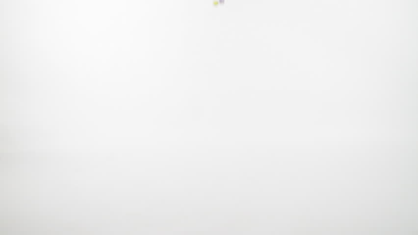 Slow motion Bouncy Balls on White wall (cyc).