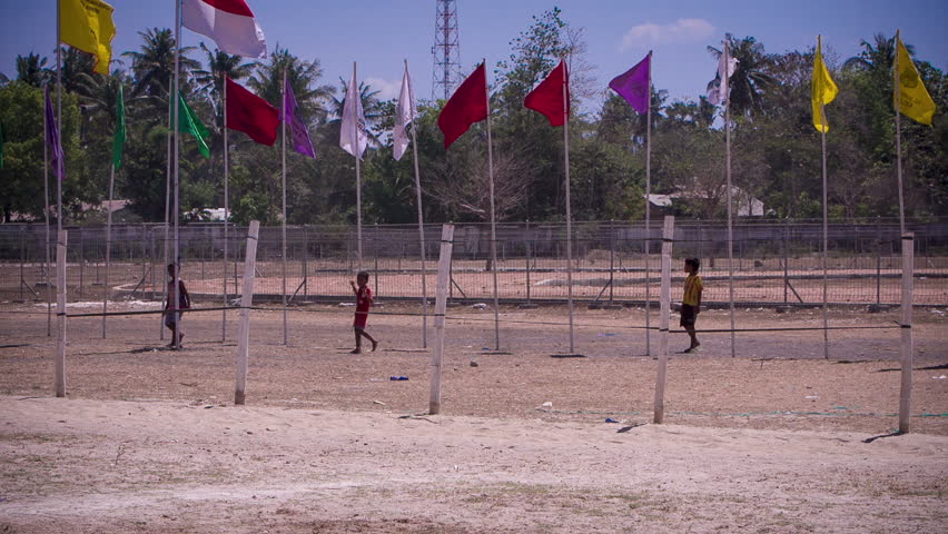 BOY JOCKEYS RACE IN SUMBA, INDONESIA IN SLOW MOTION
