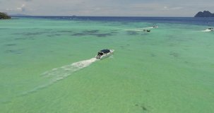 Aerial video of the clear water and boats at Phi-Phi island. Drone video of speed boat. Thailand, phi phi islands, 2017.
