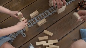 the young family plays at home on a floor wooden tower. - Powered by Shutterstock - Get 15% off with code: PIKWIZARD15