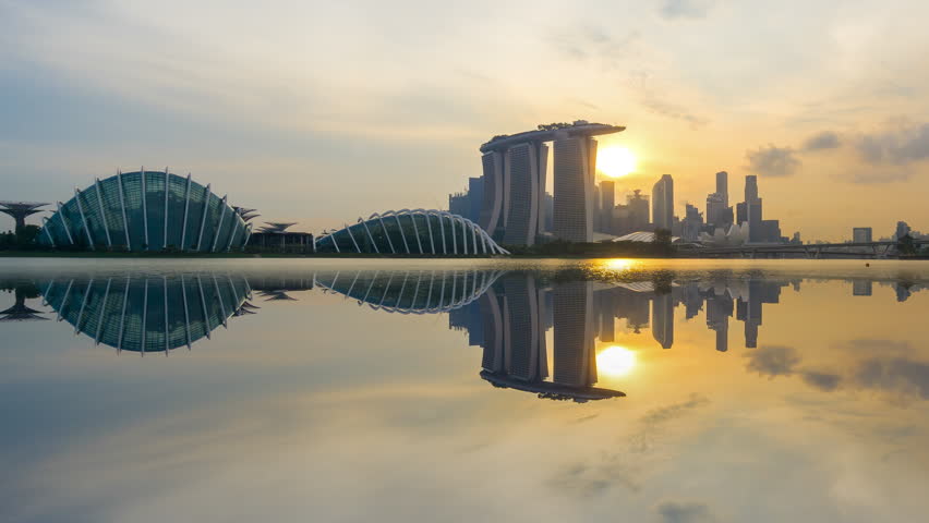 Beautiful Time lapse of Day to Night of Singapore skyline with reflection. 4K UHD. Zoom Out Camera Motion. Royalty-Free Stock Footage #26922211