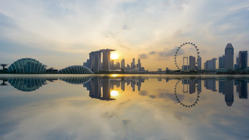 Beautiful Time lapse of Day to Night of Singapore skyline with reflection. 4K UHD. Pan Down Camera Motion. Royalty-Free Stock Footage #26922238