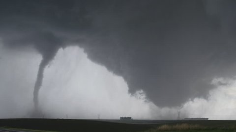 Dual tornadoes sweeping across farmland near Wakefield, Nebraska