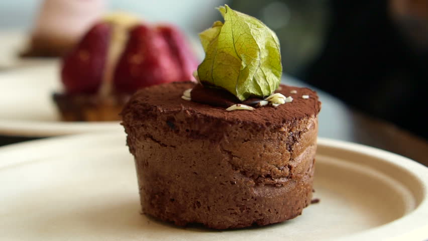Three cakes at different focus. lava chocolate cake, strawberry tart and cream raspberry bake