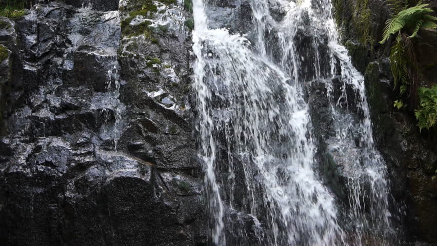 Cascade or waterfall in black, white and green colors