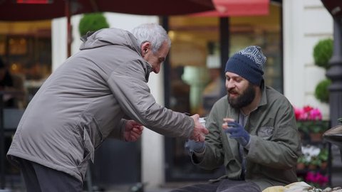 helping a homeless: pity, generosity, brotherhood