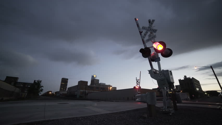 Train intersection stop on cloudy sunset