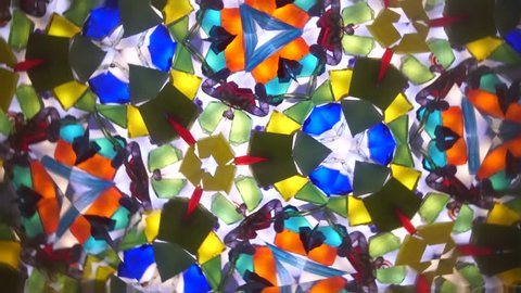 Live abstract colorful kaleidoscope pattern. View from inside of an vintage optical toy (instrument with mirror and reflecting surfaces)