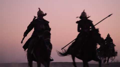 Horsemen warriors silhouetted, Medieval Cavalry attacks the Enemy