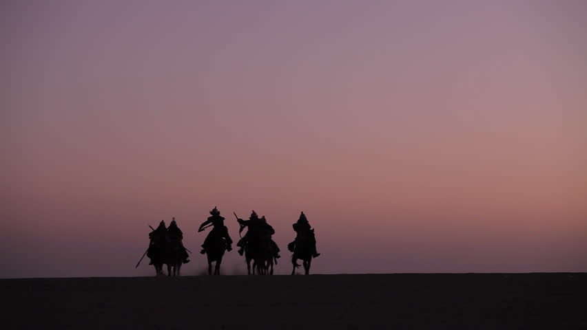 Horsemen warriors silhouetted, Medieval Cavalry attacks the Enemy Royalty-Free Stock Footage #26946640