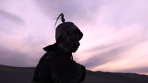 Silhouetted Medieval Archer Shooting