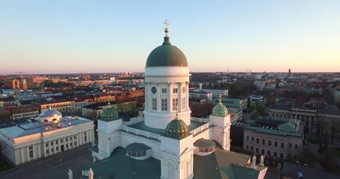 4K aerial drone footage of Helsinki old cathedral and central square area near city center and harbour market square with city skyline and Baltic Sea view in the capital of Finland, northern Europe