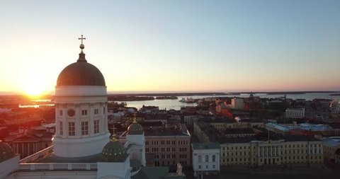 Aerial view drone footage of Helsinki old cathedral and central square area near city center and harbour market square with city skyline and Baltic Sea view in the capital of Finland, northern Europe
