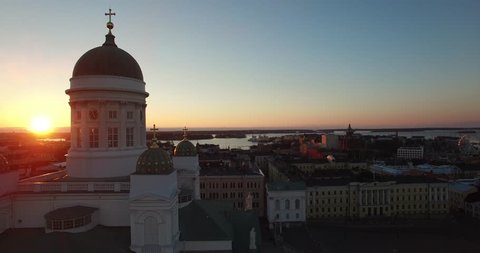 Aerial view drone footage of Helsinki old cathedral and central square area near city center and harbour market square with city skyline and Baltic Sea view in the capital of Finland, northern Europe