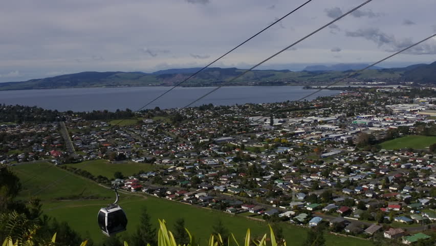 Gondola cable car lift  ride above Rotorua lake and Rotorua city, in the center of North Island of New Zealand. No people. Copy space