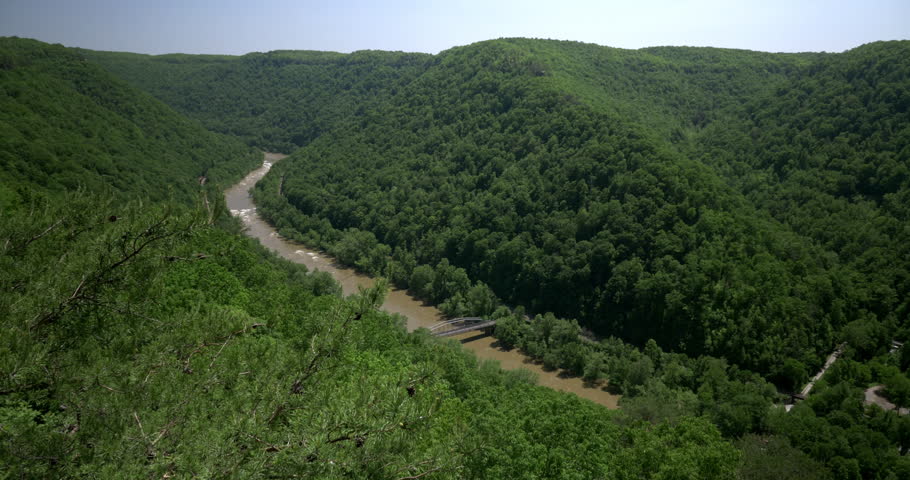 A high angle summer establishing shot of the New River Gorge in West Virginia.  	