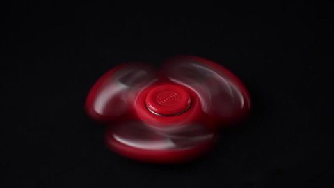 Red spinner on black background.